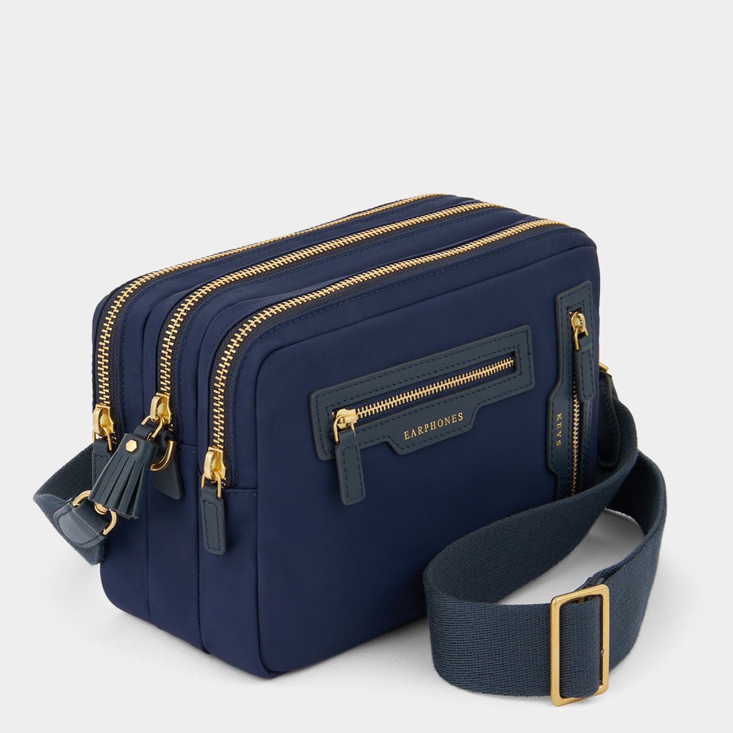 Trio Cross-body -

          
            Regenerated ECONYL® Nylon in Marine -
          

          Anya Hindmarch EU
