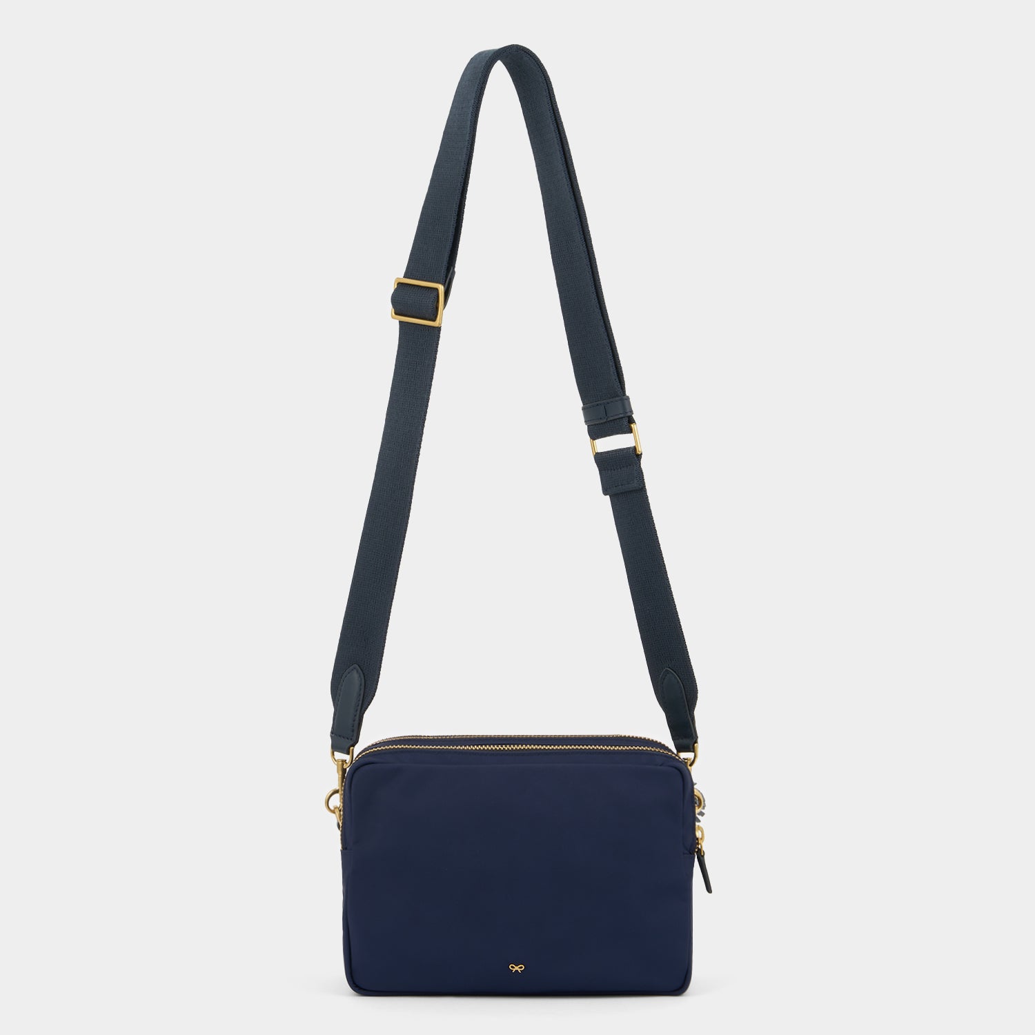 Trio Cross-body -

          
            Regenerated ECONYL® Nylon in Marine -
          

          Anya Hindmarch EU
