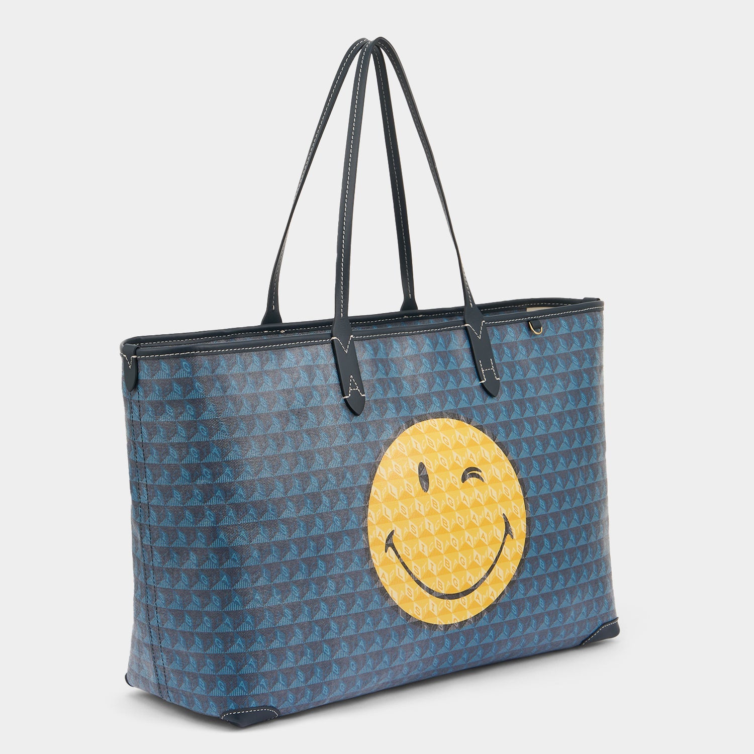 I am a Plastic Bag Wink Zipped Tote -

          
            Recycled Canvas in Marine -
          

          Anya Hindmarch EU
