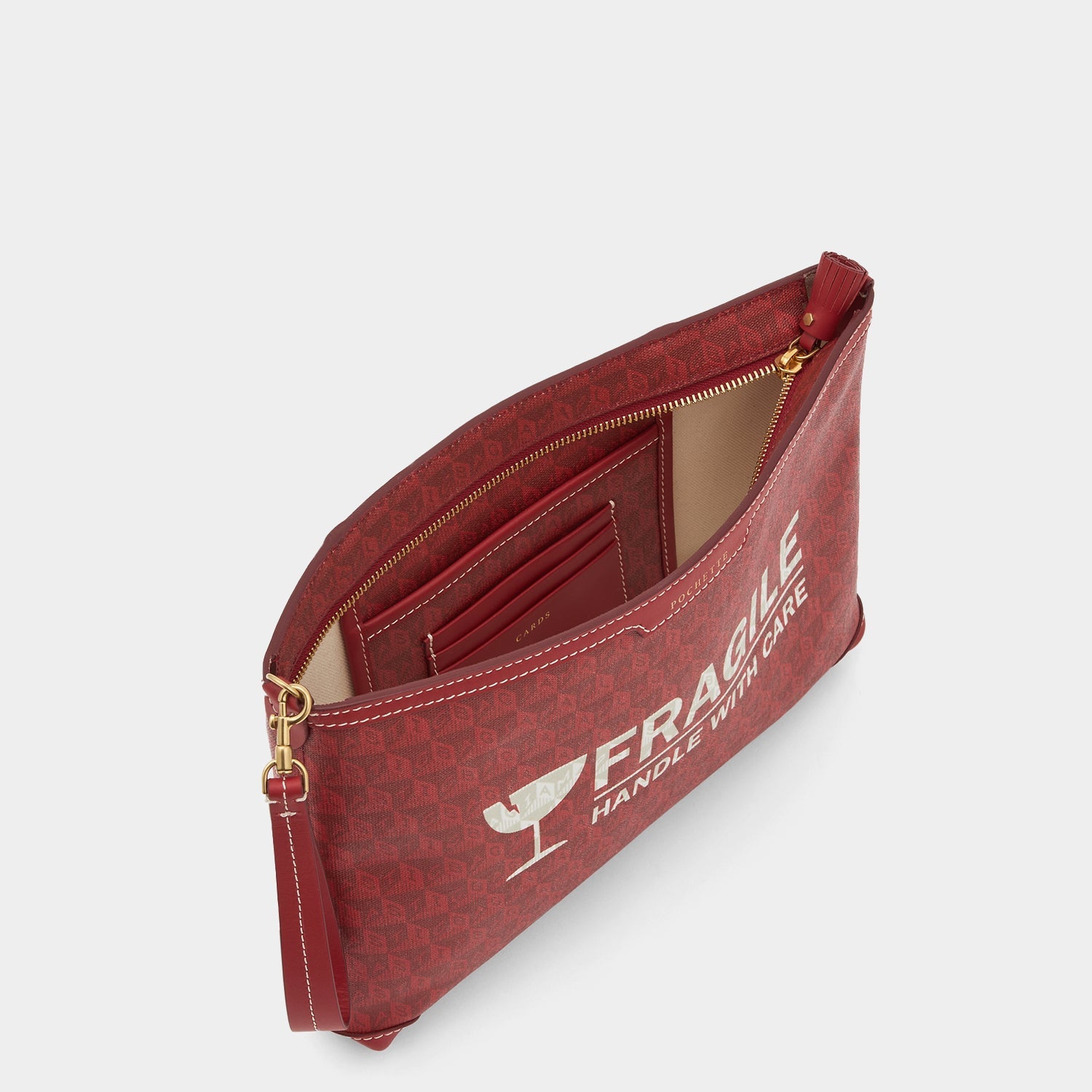 Fragile I am a Plastic Bag Pochette -

          
            Recycled Canvas in Vampire -
          

          Anya Hindmarch EU
