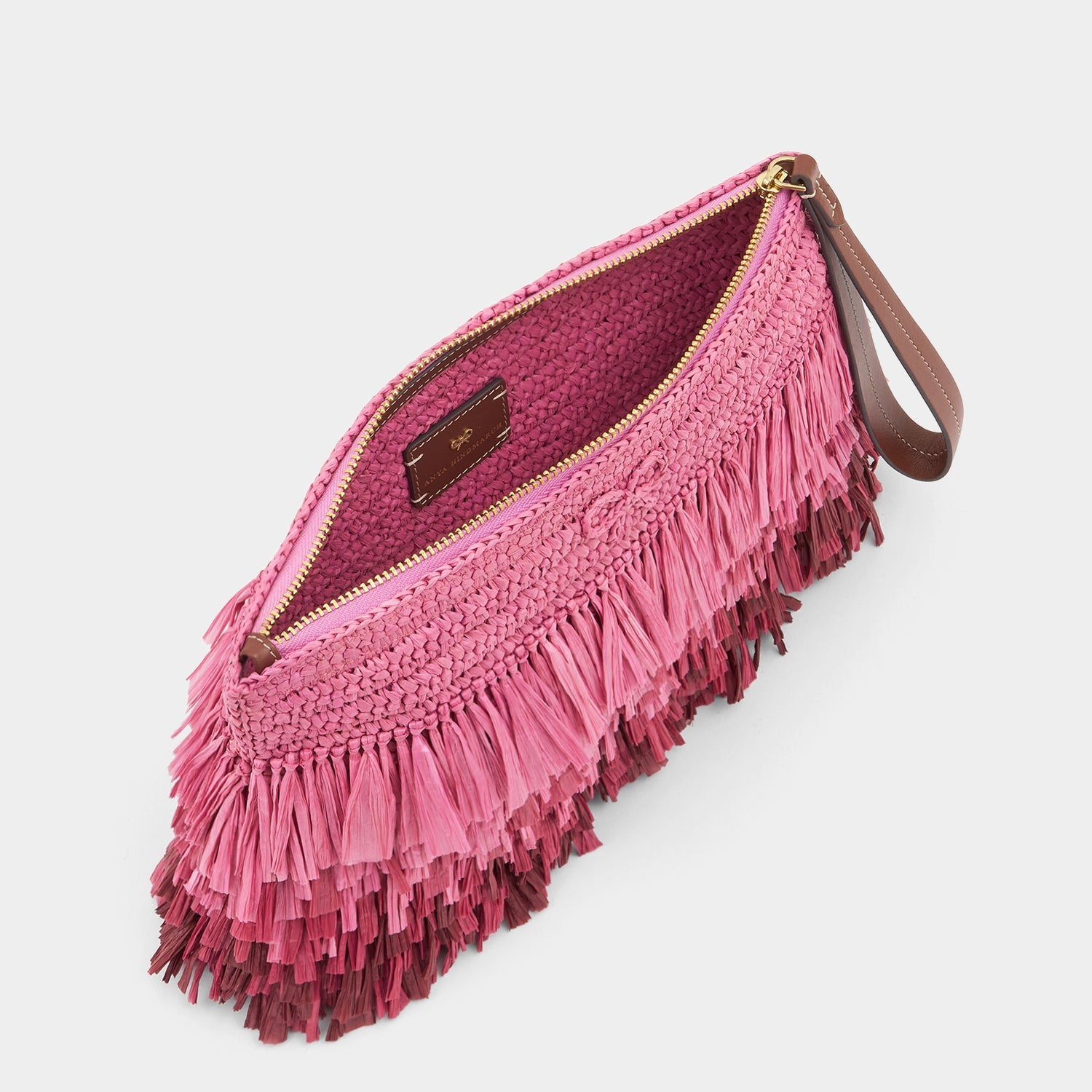 Pink raffia clutch by Anya Hindmarch