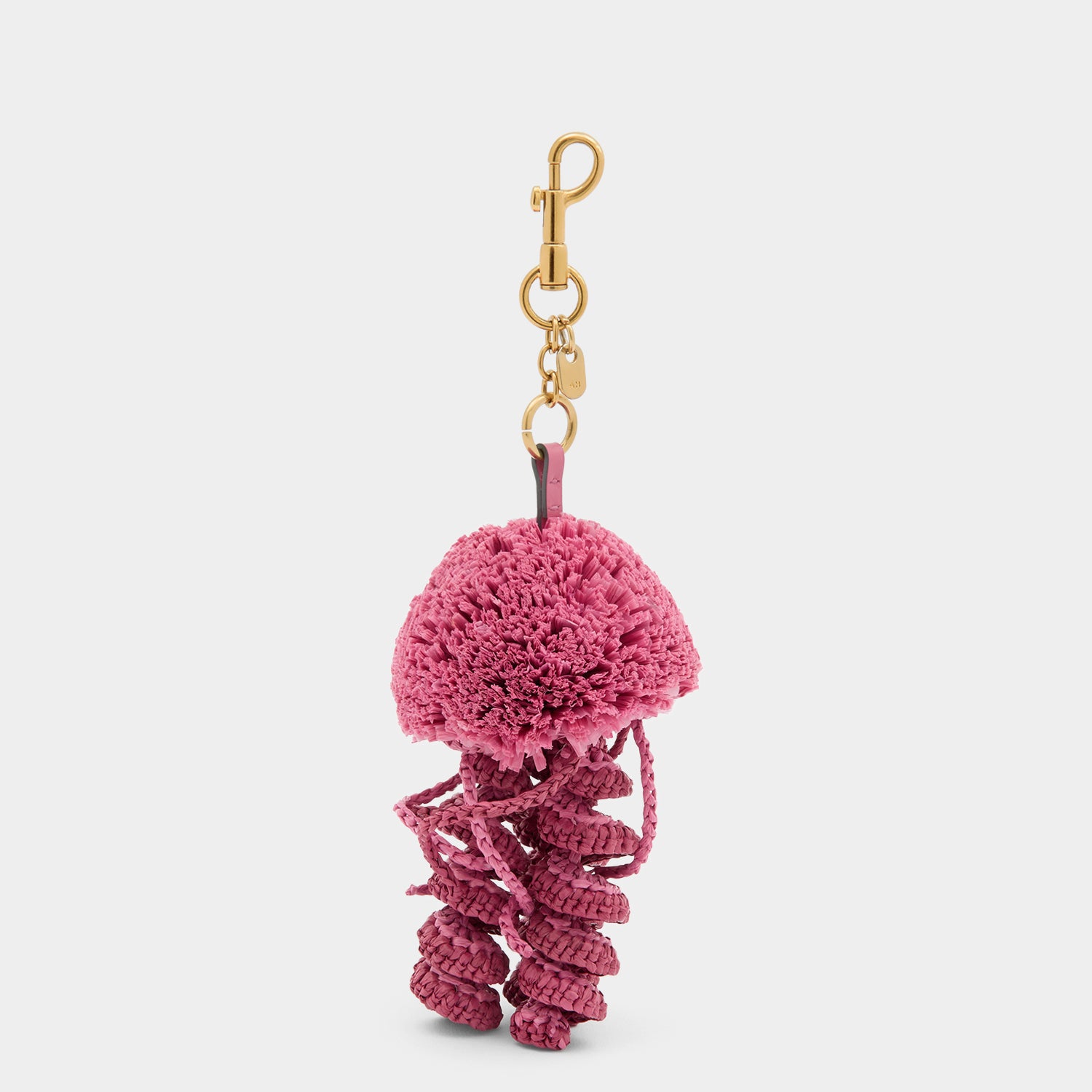 Pink jellyfish charm made of raffia by Anya Hindmarch