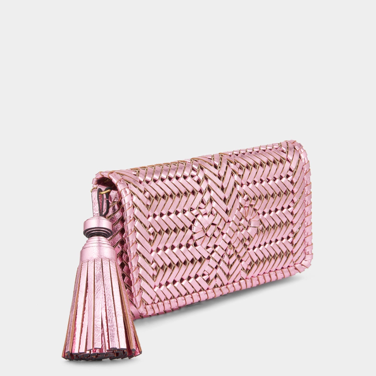 Metallic pink handwoven leather clutch bag by Anya Hindmarch
