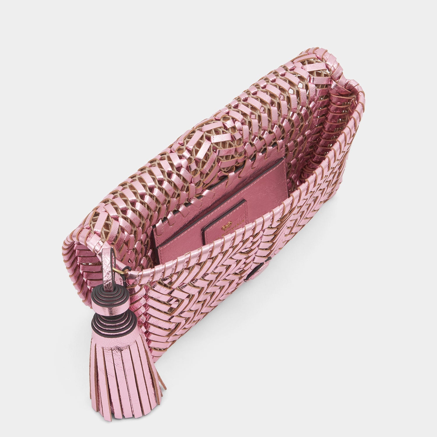 Metallic pink handwoven leather clutch bag by Anya Hindmarch