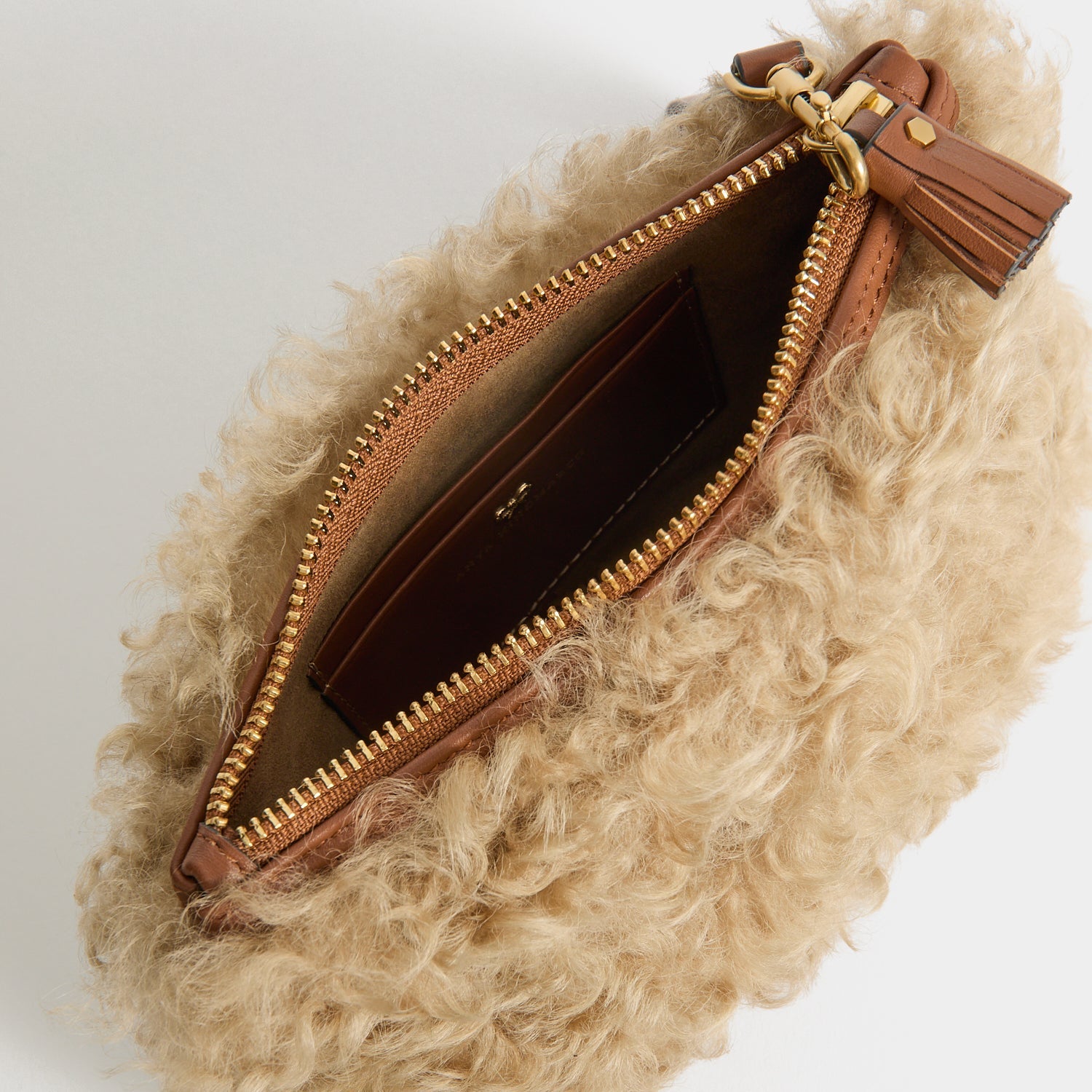 Shearling Eyes Clutch -

          
            Shearling/Smooth Leather leather in Taupe -
          

          Anya Hindmarch EU
