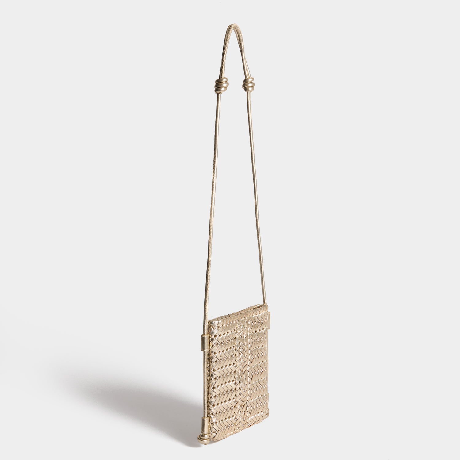 Neeson Cross-body Pouch -

          
            Capra Leather in Platino Gold -
          

          Anya Hindmarch EU
