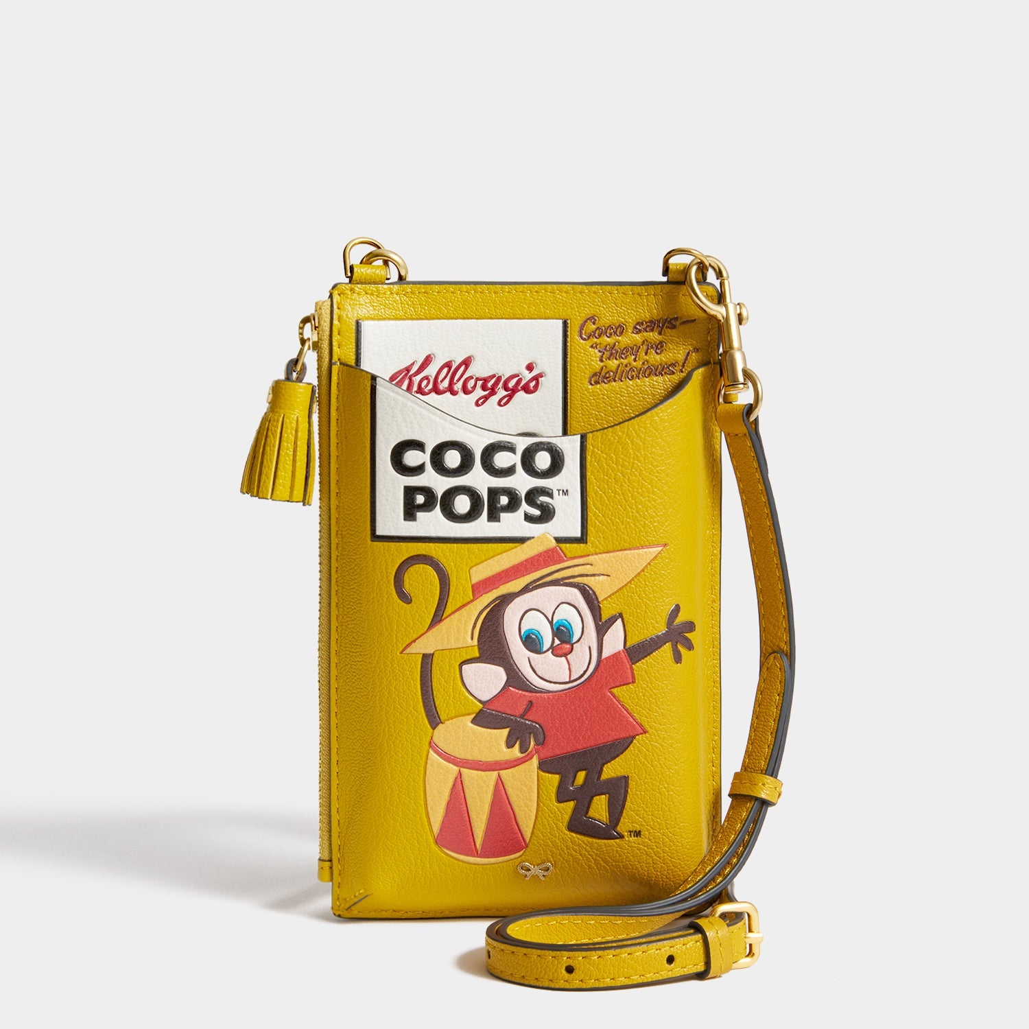 Anya Brands Coco Pops Zip Phone Pouch -

          
            Shiny Capra Leather in Mustard -
          

          Anya Hindmarch EU
