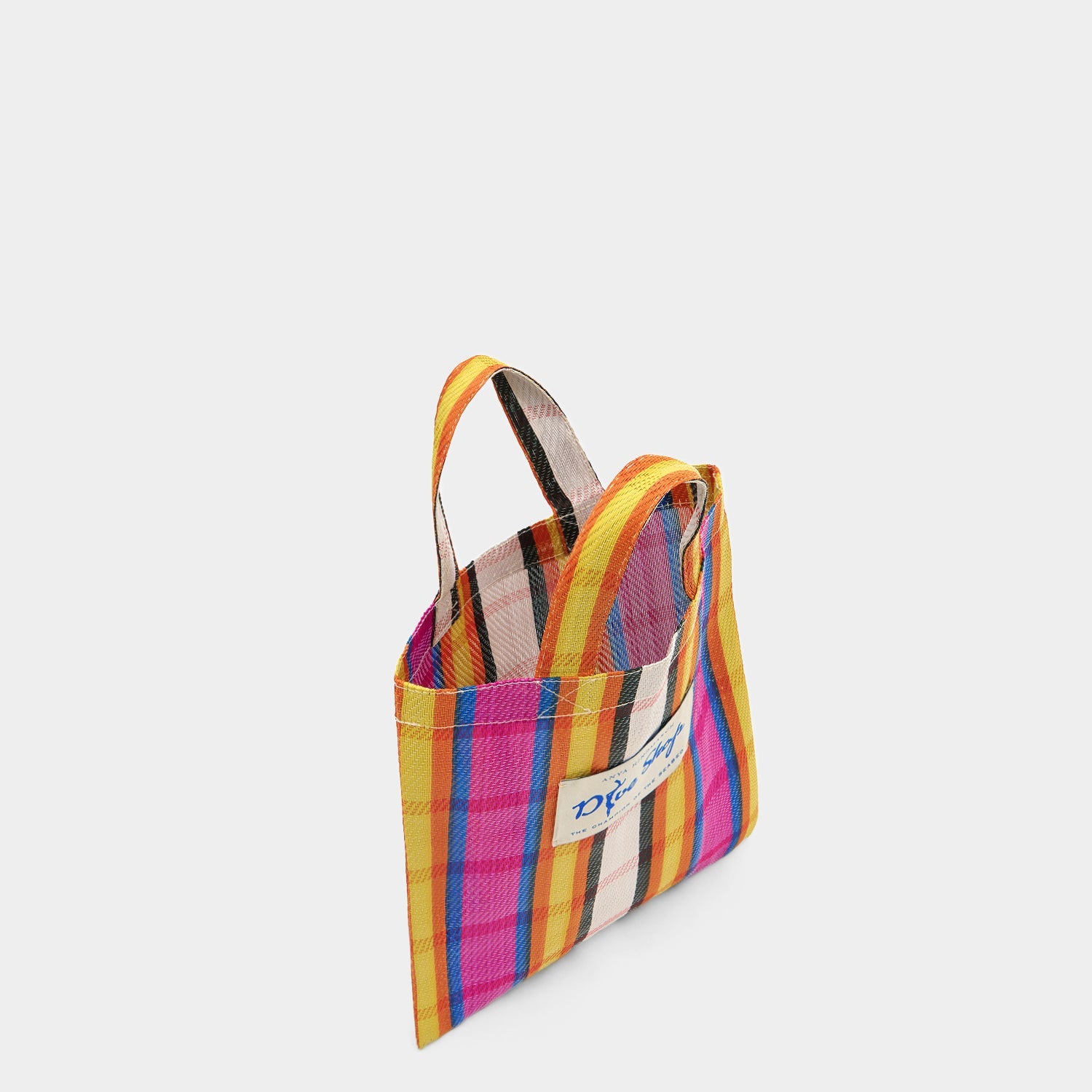 Multicoloured stripy tote bag made of recycled plastic by Anya Hindmarch