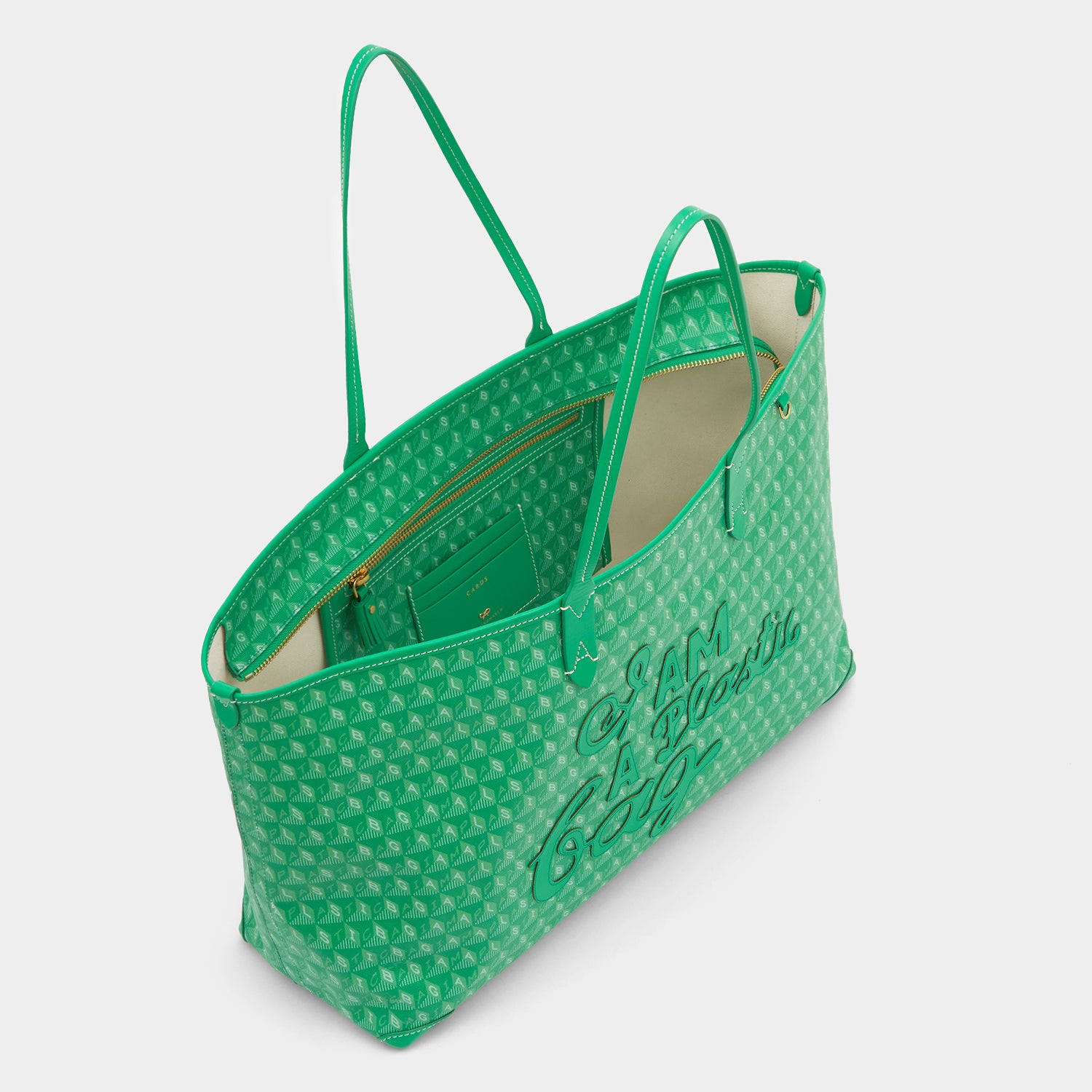 Green tote bag made of recycled plastic by Anya hindmarch