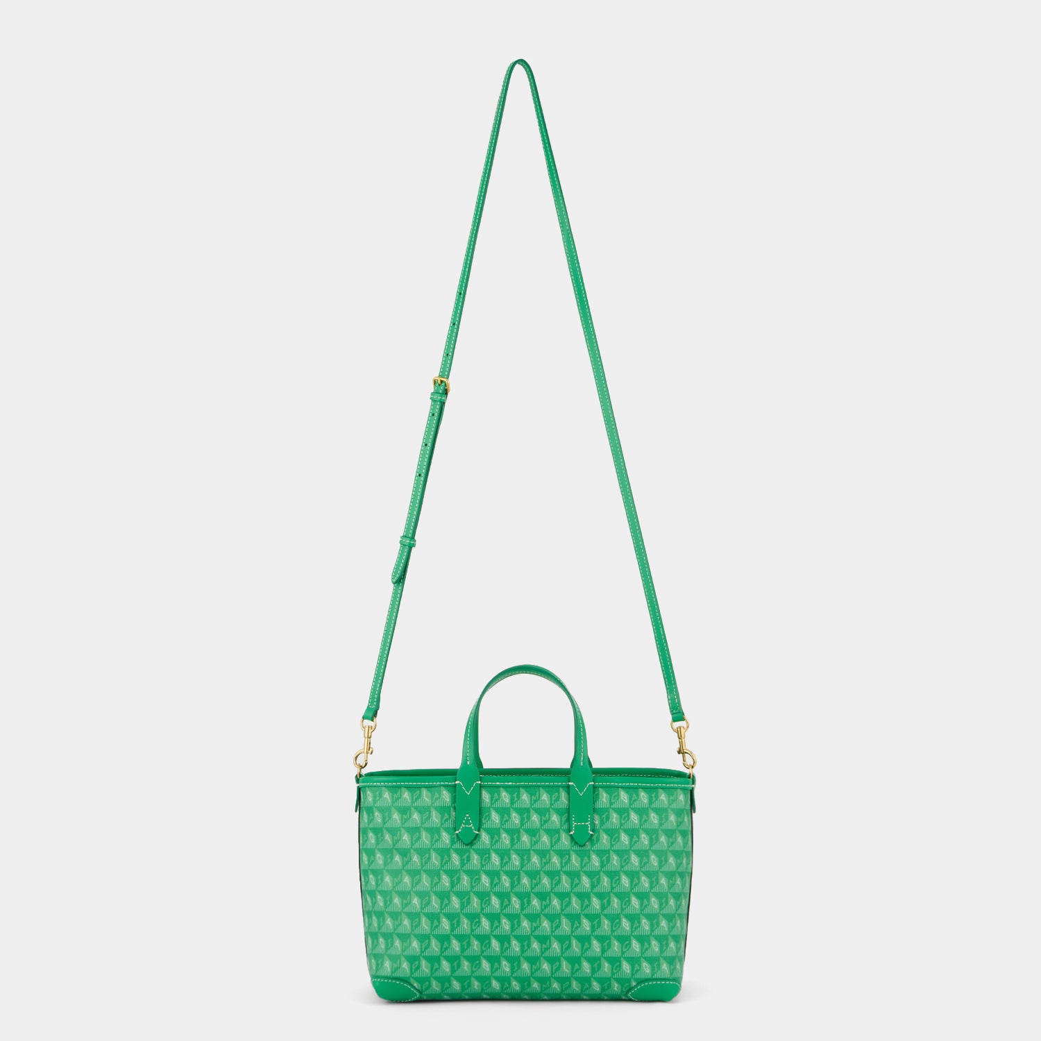 Green small tote bag with adjustable strap made of recycled plastic by anya hindmarch