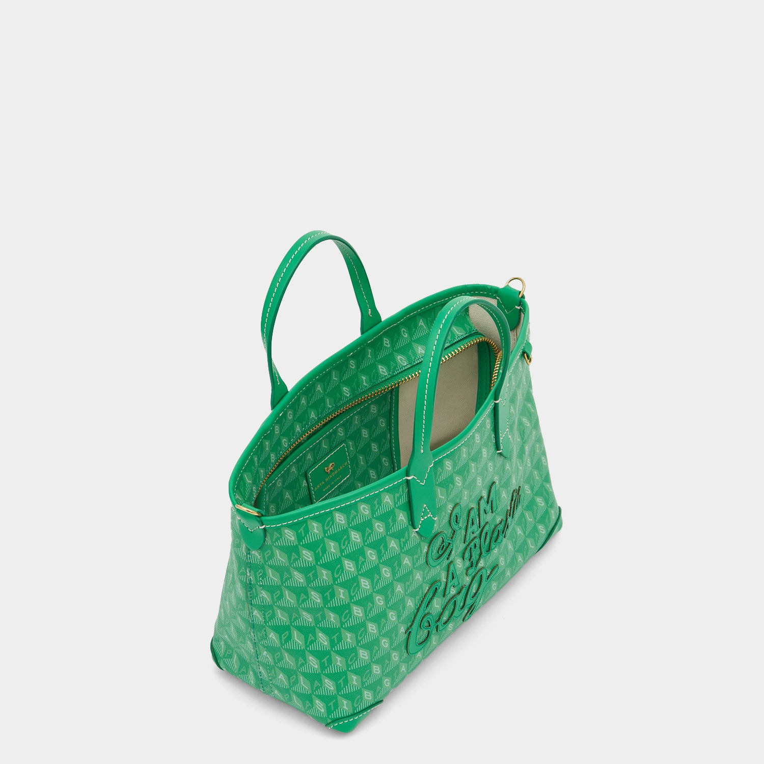 Green small tote bag with adjustable strap made of recycled plastic by anya hindmarch