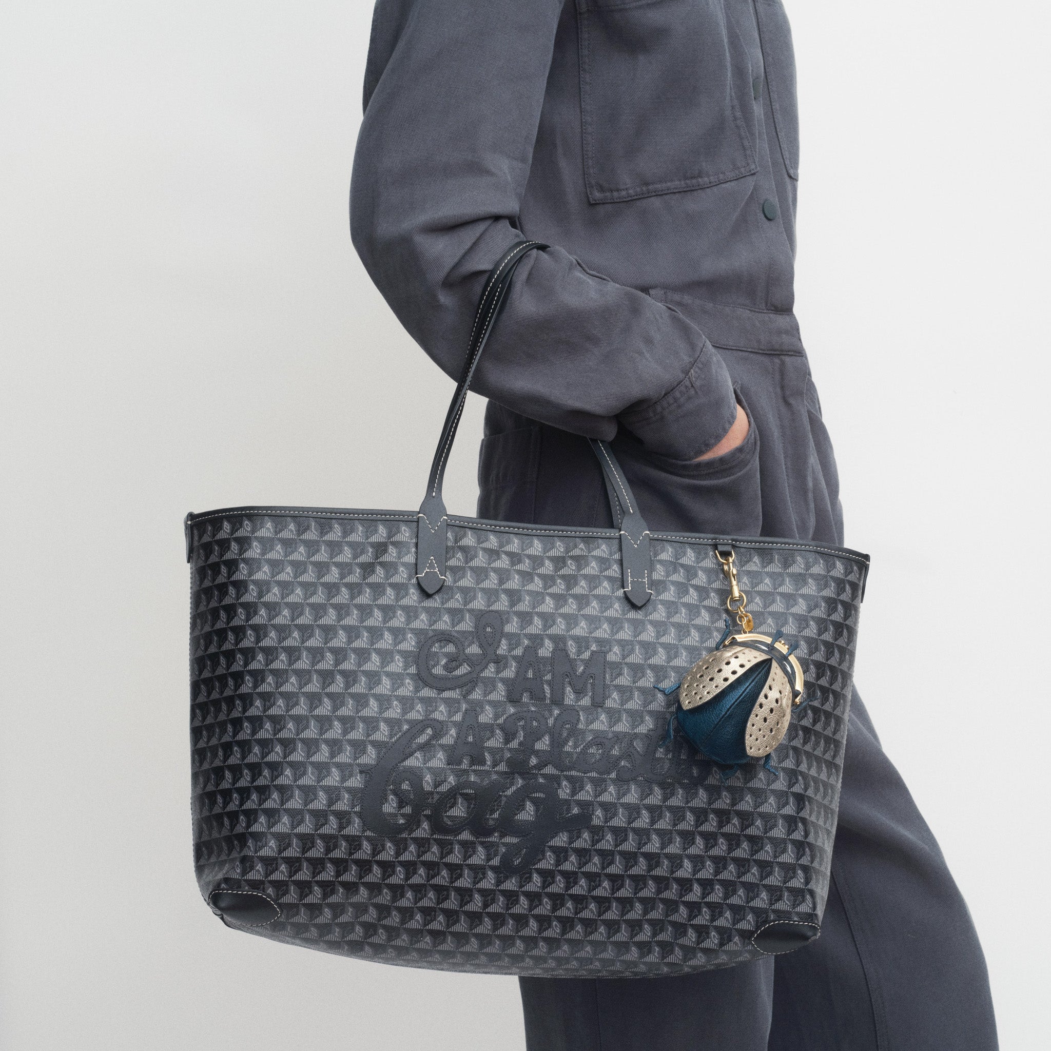 I Am A Plastic Bag Zipped Motif Tote -

          
            Recycled Canvas in Black -
          

          Anya Hindmarch EU
