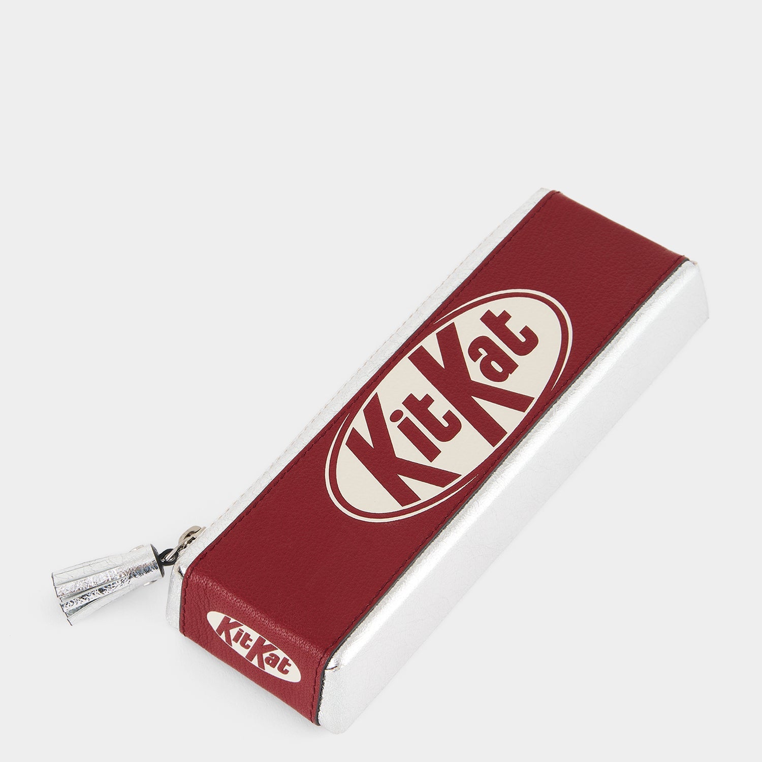 Anya Brands Kit Kat Pencil Case -

          
            Calf Leather in Red and Metallic Silver -
          

          Anya Hindmarch EU
