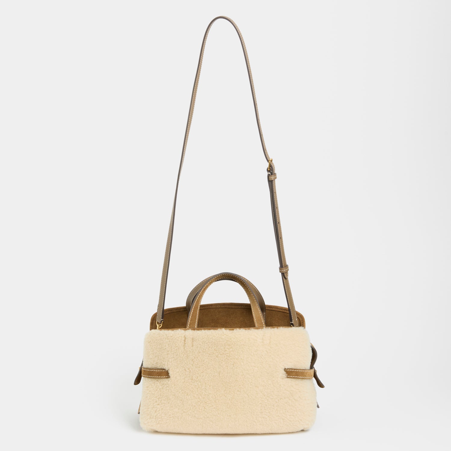 Wilson Shearling Cross-body -

          
            Shearling/Suede Leather in Moutarde -
          

          Anya Hindmarch EU

