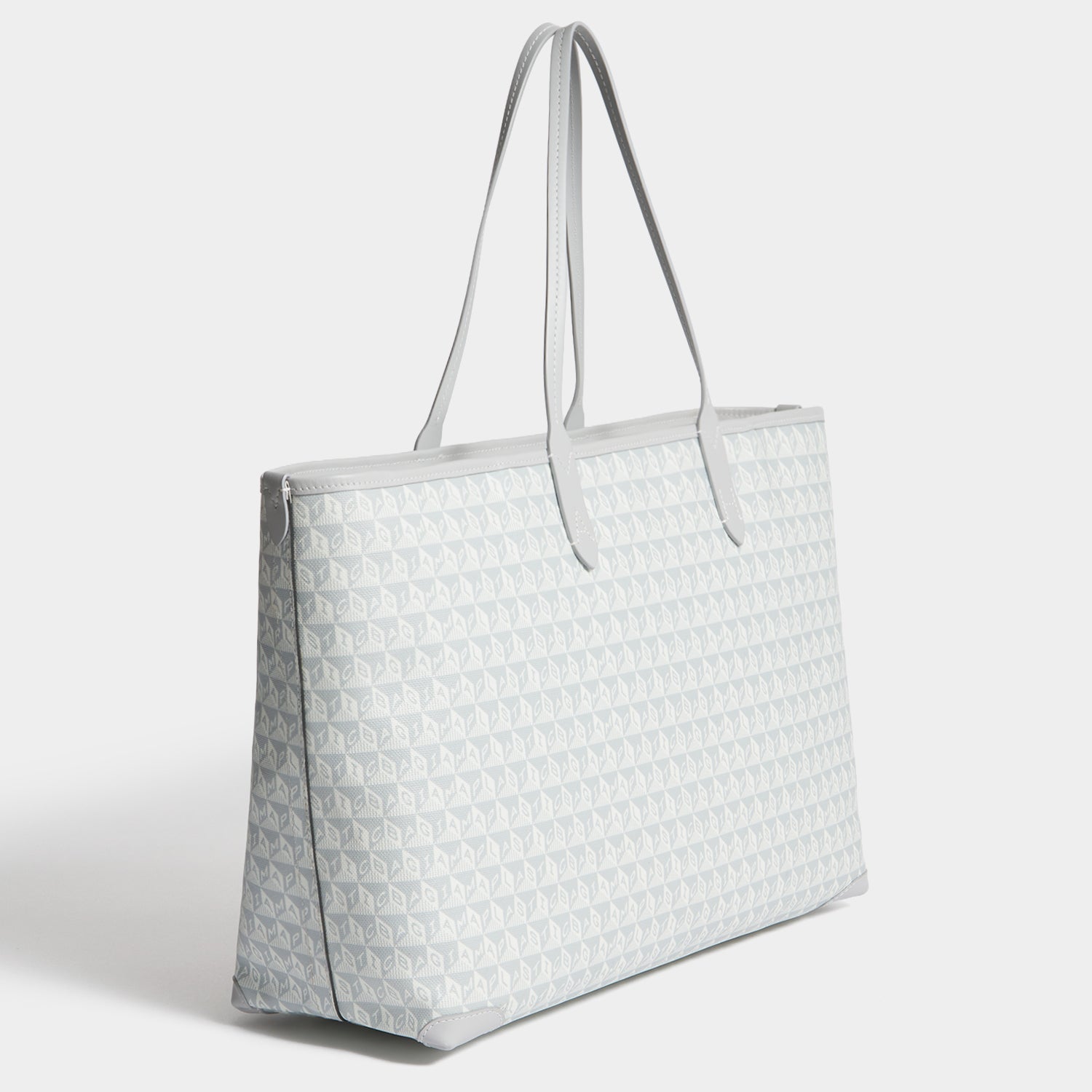 I Am A Plastic Bag Wink Zipped Tote -

          
            Recycled Canvas in Frost -
          

          Anya Hindmarch EU
