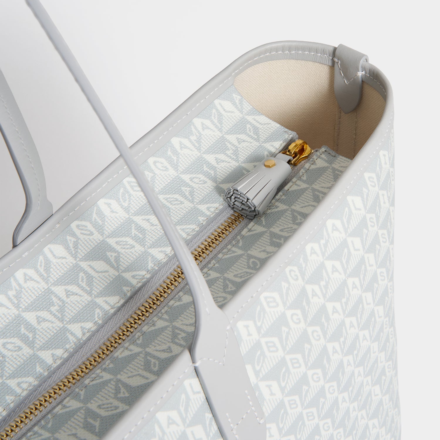 I Am A Plastic Bag Wink Zipped Tote -

          
            Recycled Canvas in Frost -
          

          Anya Hindmarch EU
