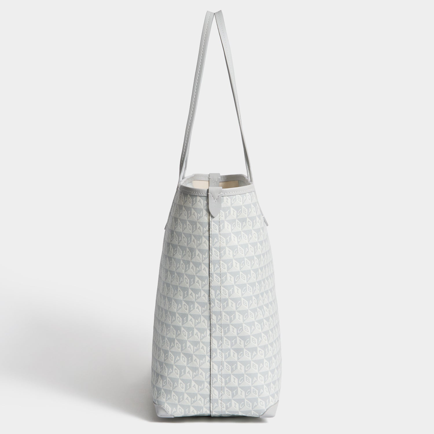 I Am A Plastic Bag Wink Zipped Tote -

          
            Recycled Canvas in Frost -
          

          Anya Hindmarch EU
