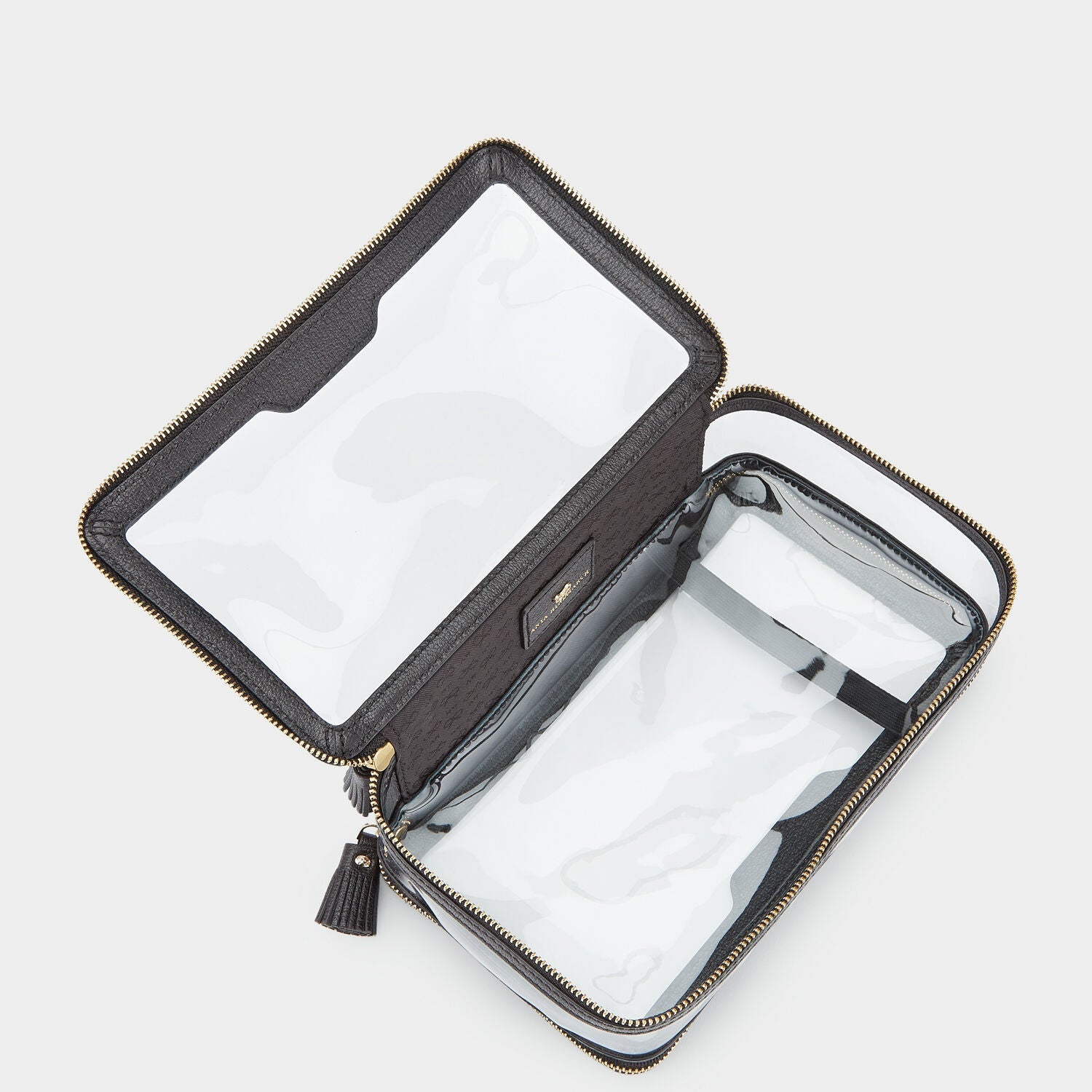 In-Flight Case -

          
            Capra in Black -
          

          Anya Hindmarch EU
