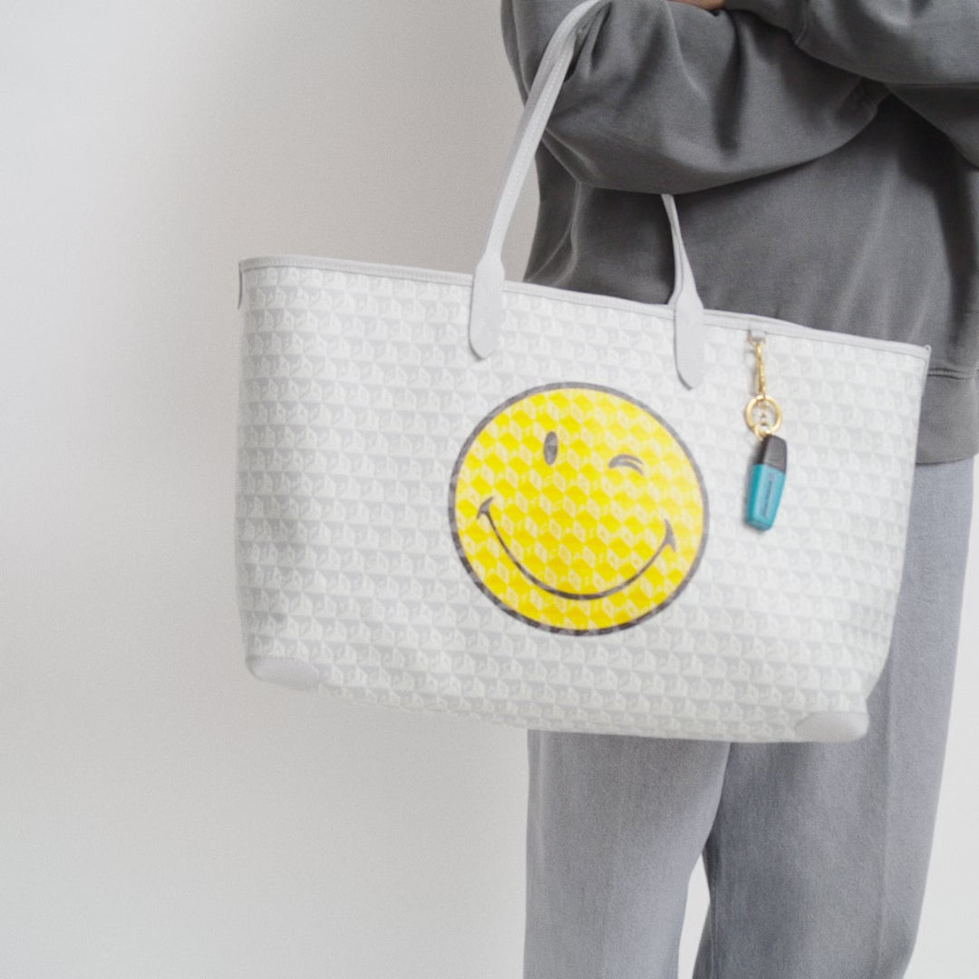 I Am A Plastic Bag Wink Zipped Tote -

          
            Recycled Canvas in Frost -
          

          Anya Hindmarch EU
