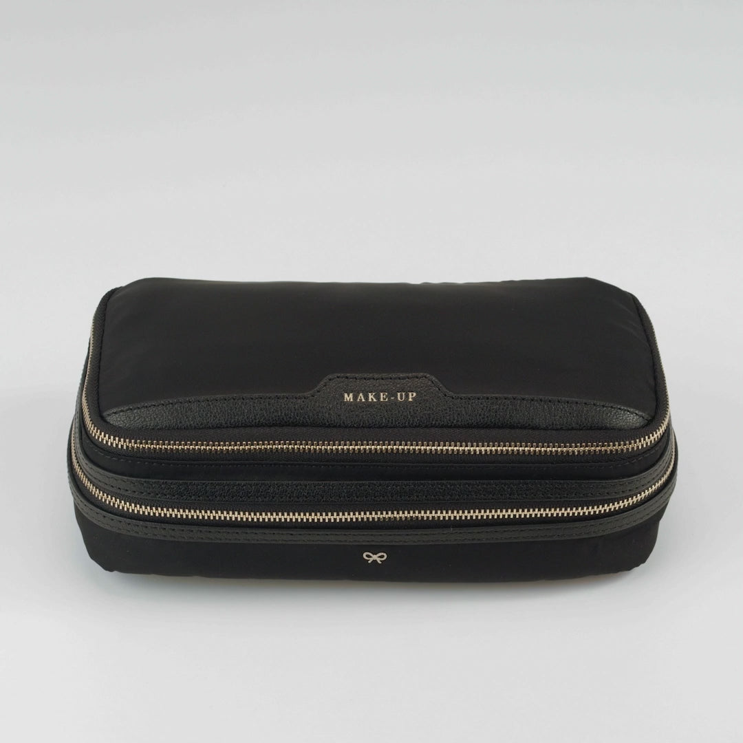 Logo Make-Up Pouch -

          
            Nylon Jacquard in New Marine -
          

          Anya Hindmarch EU
