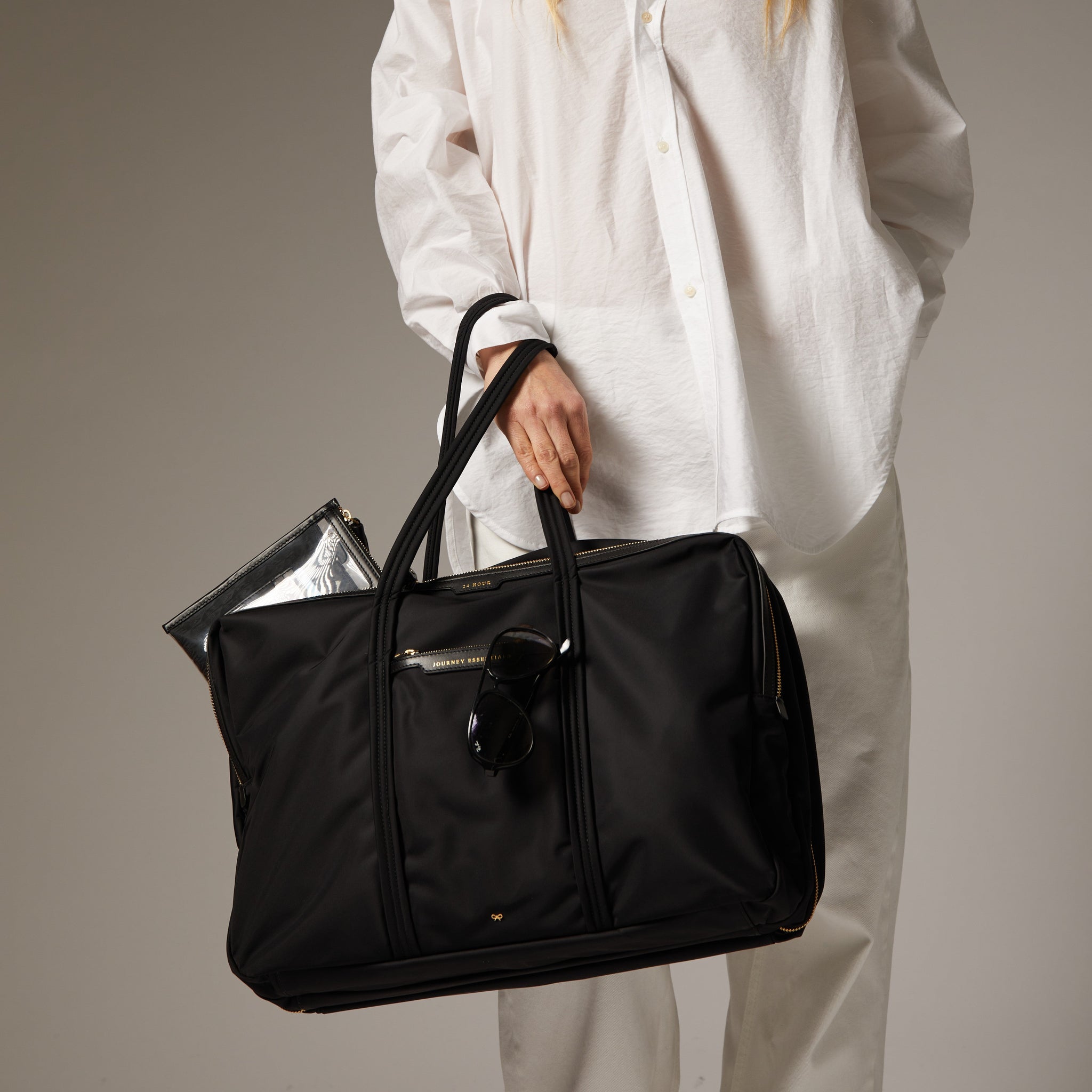 24 Hour Travel Bag -

                  
                    Econyl® Regenerated Nylon in Black -
                  

                  Anya Hindmarch EU
