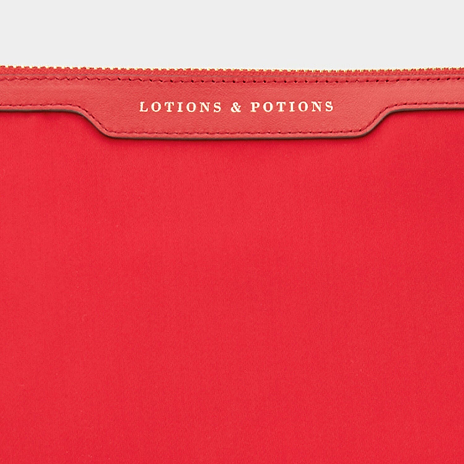 Lotions and Potions Pouch -

                  
                    ECONYL® in Red -
                  

                  Anya Hindmarch EU

