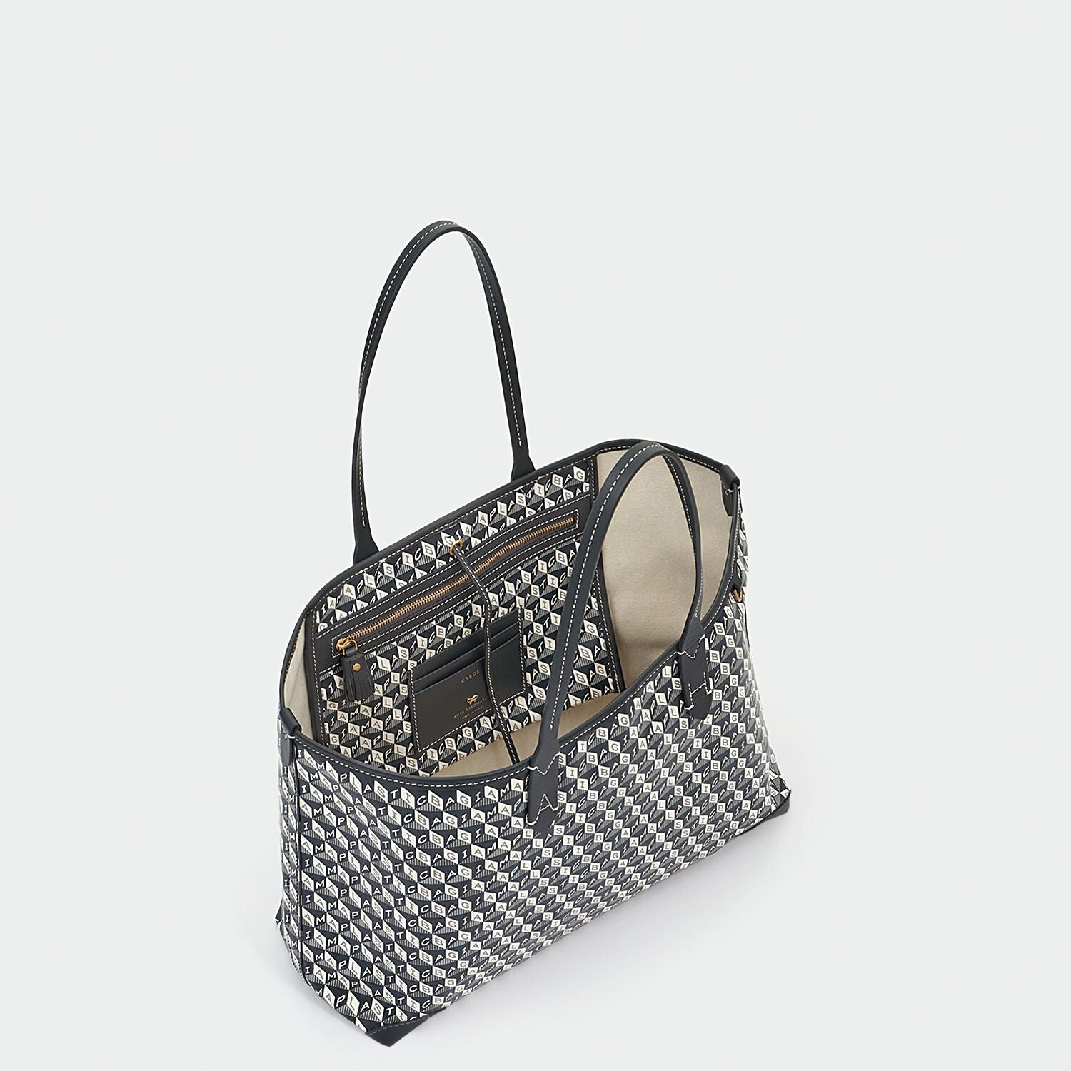 I Am A Plastic Bag Small Tote -

                  
                    Recycled Coated Canvas in Charcoal -
                  

                  Anya Hindmarch EU
