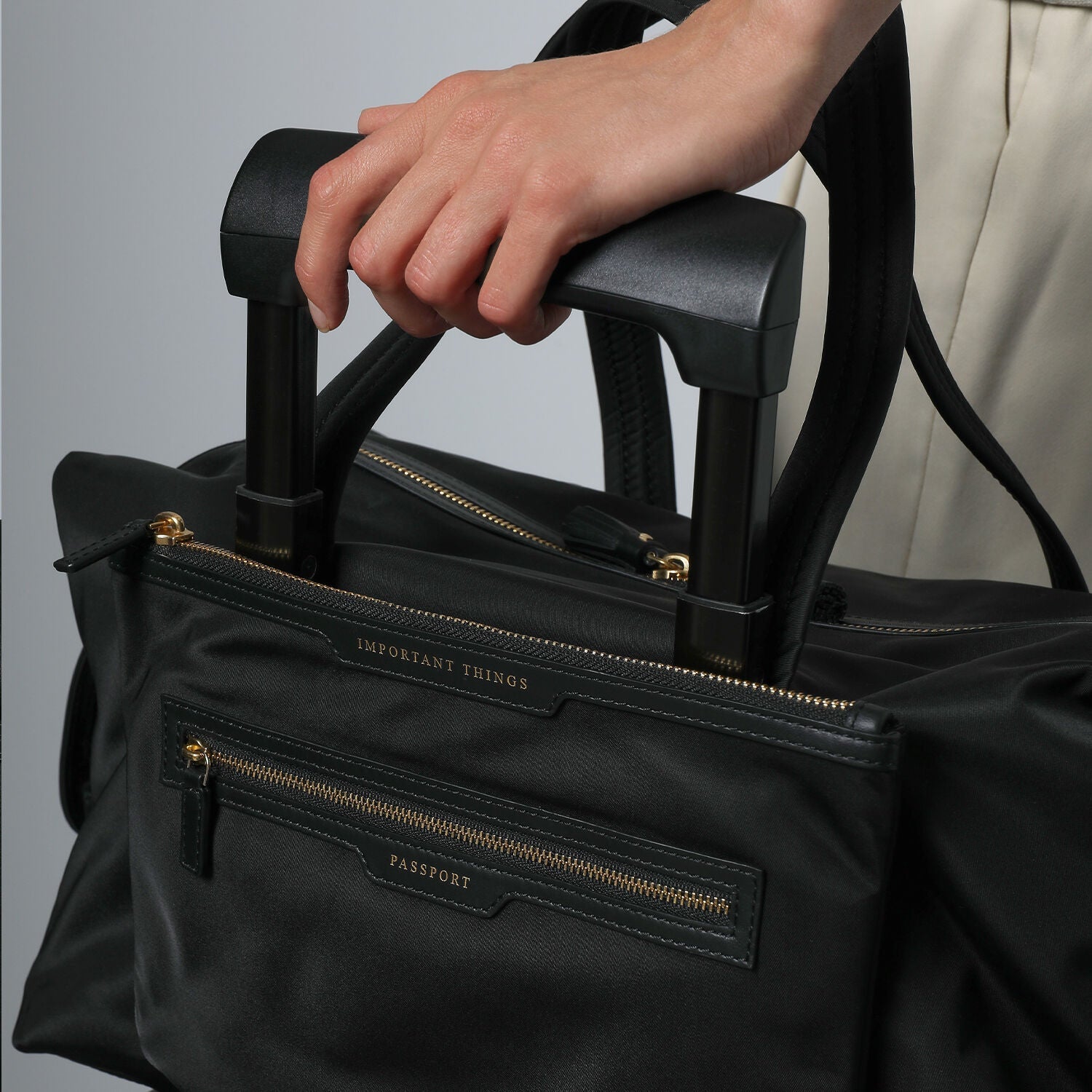 In-Flight Travel Bag -

                  
                    Regenerated Econyl® in Black -
                  

                  Anya Hindmarch EU
