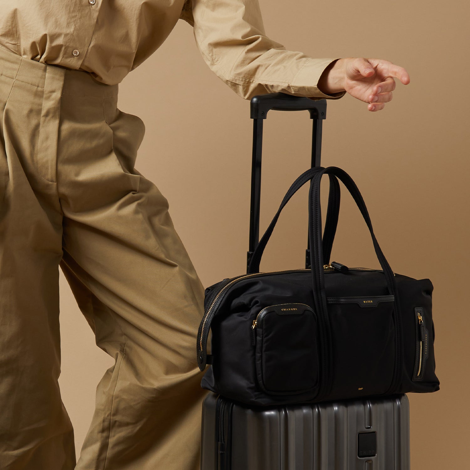 In-Flight Travel Bag -

                  
                    Regenerated Econyl® in Black -
                  

                  Anya Hindmarch EU
