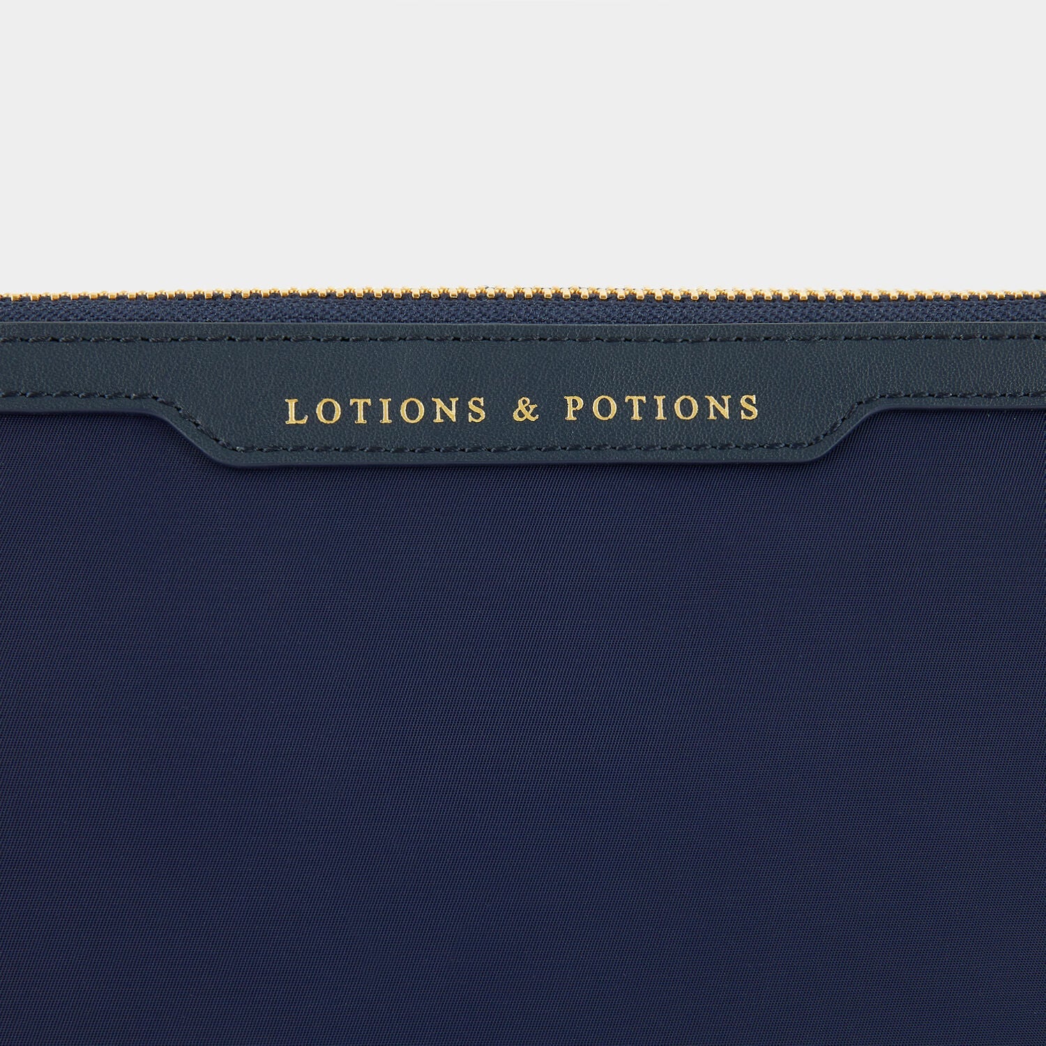 Lotions and Potions Pouch -

                  
                    ECONYL® in Dark Marine -
                  

                  Anya Hindmarch EU
