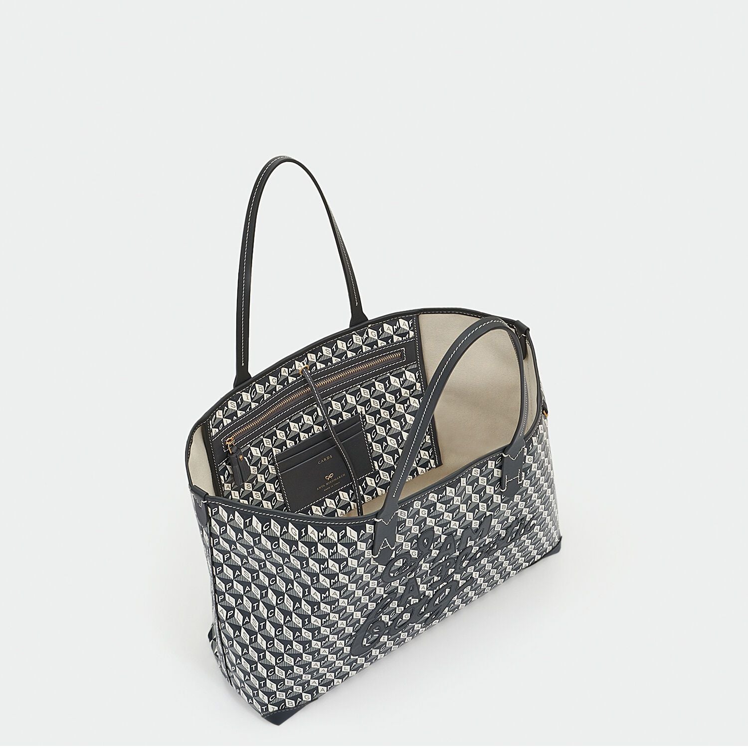 I Am A Plastic Bag Small Motif Tote -

                  
                    Recycled Coated Canvas in Charcoal -
                  

                  Anya Hindmarch EU

