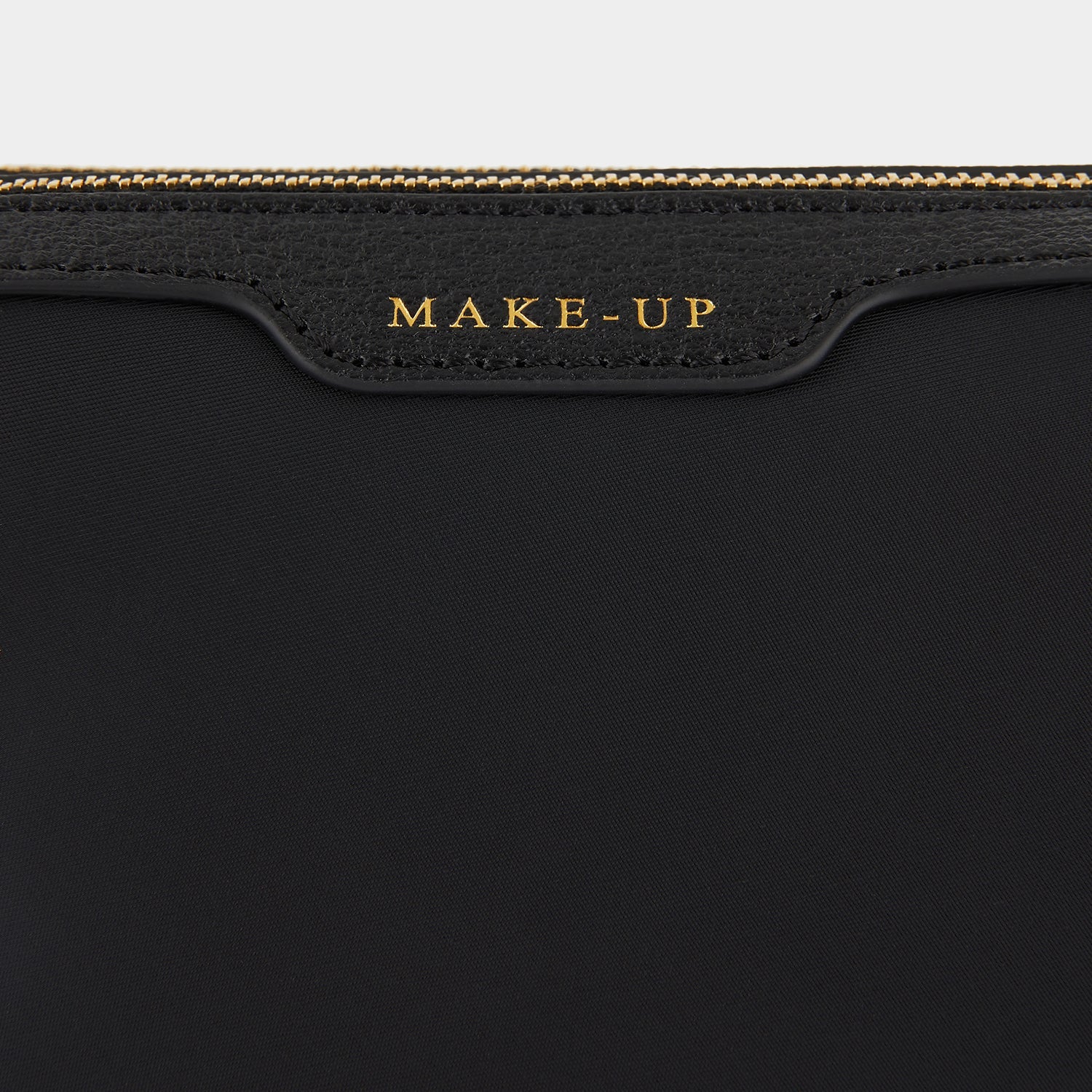 Small Make-Up Pouch -

                  
                    ECONYL® regenerated Nylon in Black -
                  

                  Anya Hindmarch EU
