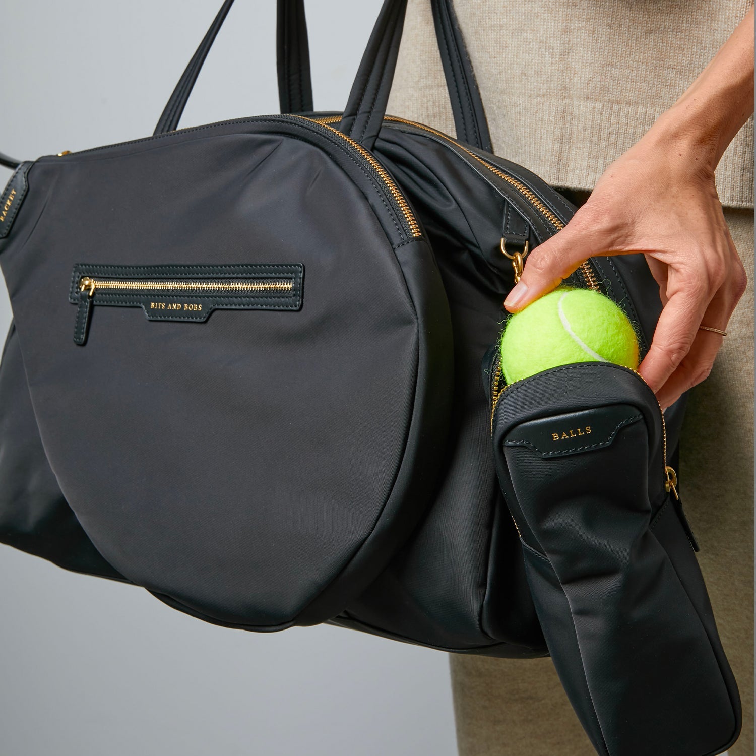 Tennis Bag -

                  
                    ECONYL® Regenerated Nylon in Black -
                  

                  Anya Hindmarch EU
