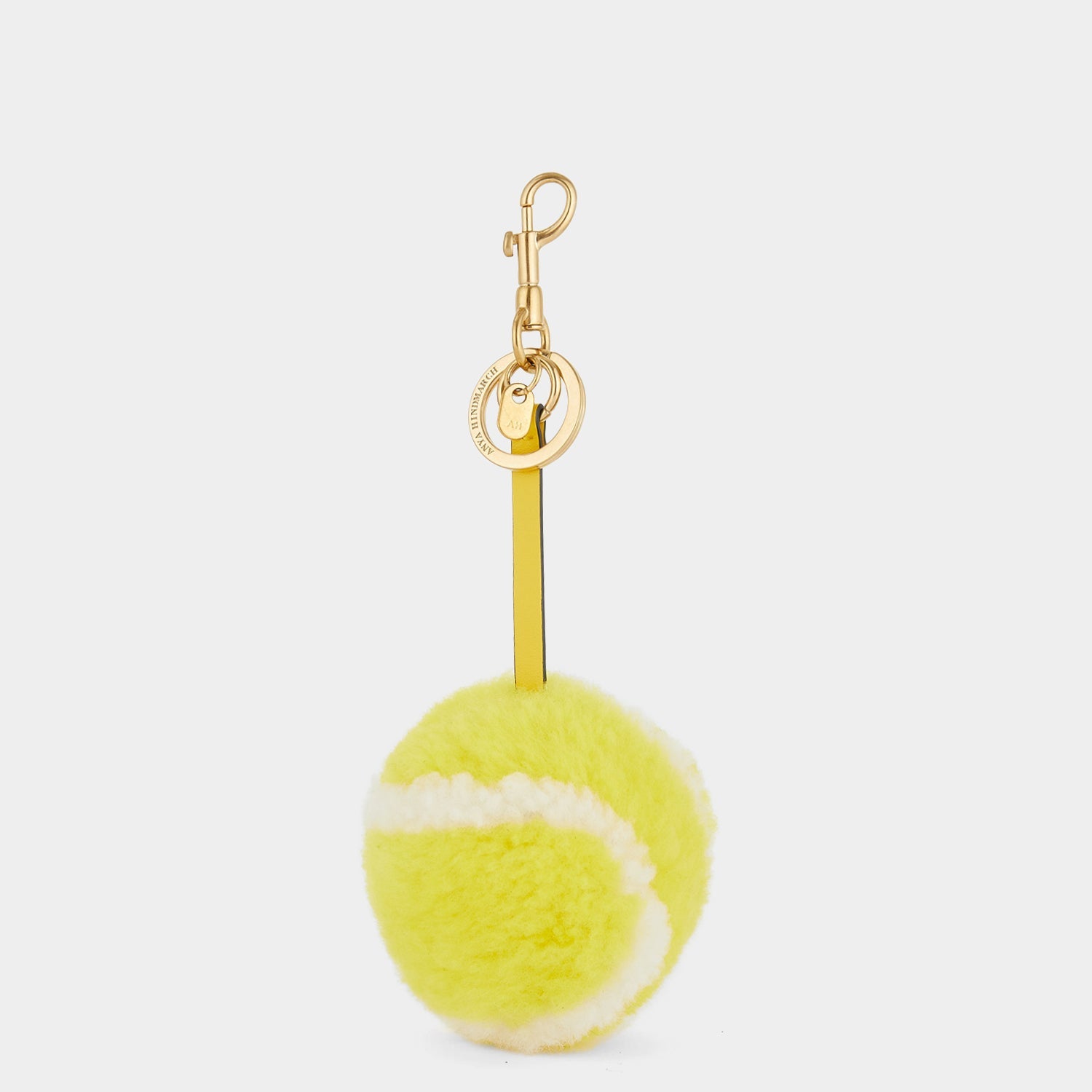 Tennis Charm -

                  
                    Shearling in Bright Lemon -
                  

                  Anya Hindmarch EU
