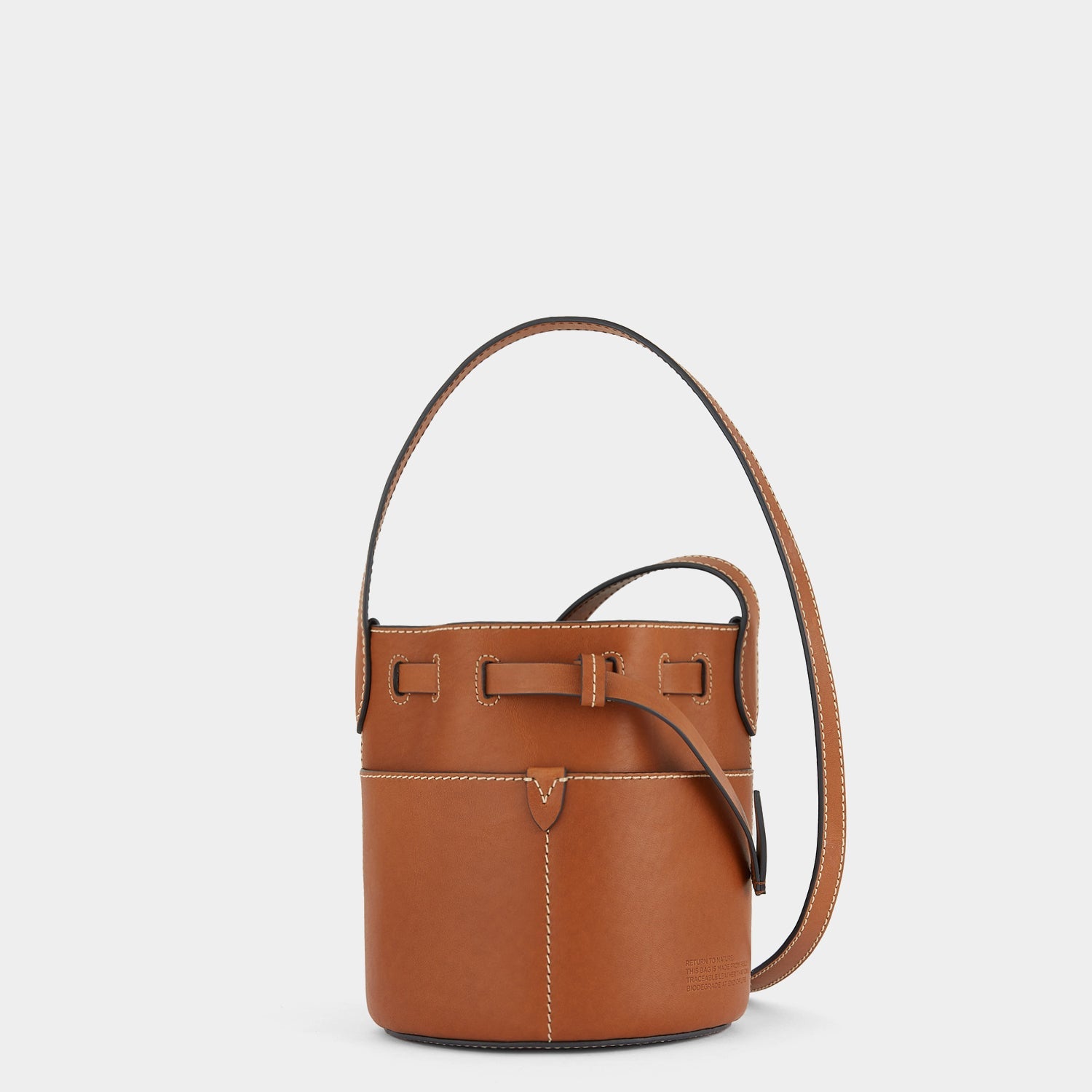Return to Nature Mini Bucket Bag -

                  
                    Compostable Leather in Tan -
                  

                  Anya Hindmarch EU
