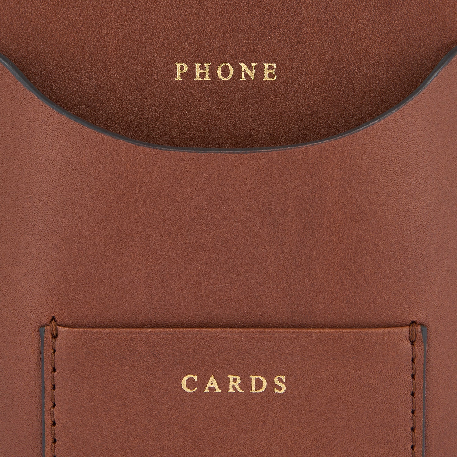 Nastro Phone Pouch on Strap -

                  
                    Flat Leather in Cedar -
                  

                  Anya Hindmarch EU
