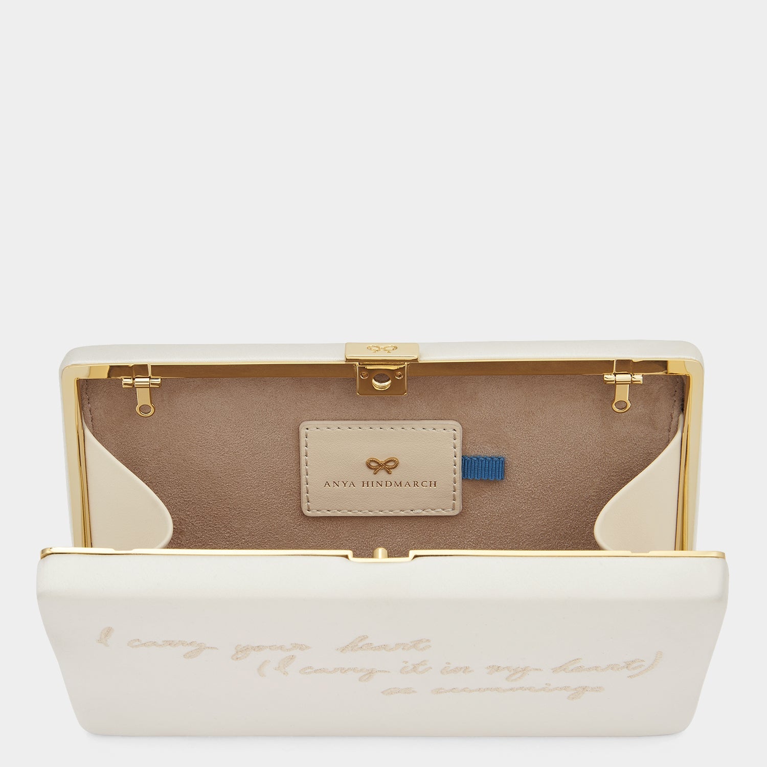 'I carry your heart' Clutch -

                  
                    Recycled Satin in Ivory -
                  

                  Anya Hindmarch EU
