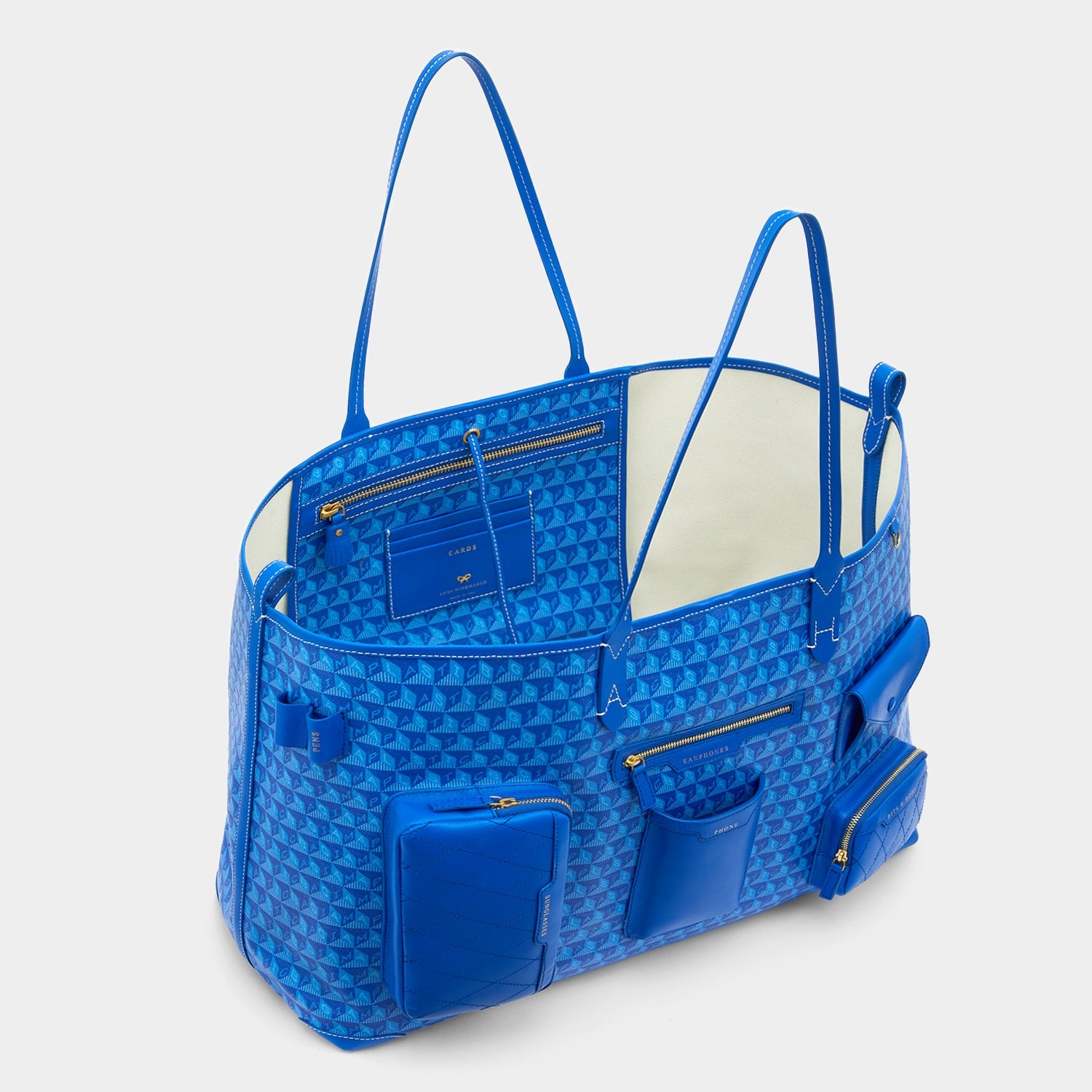 I am a Plastic Bag XL Multi Pocket Tote -

                  
                    Recycled Canvas in Electric Blue -
                  

                  Anya Hindmarch EU
