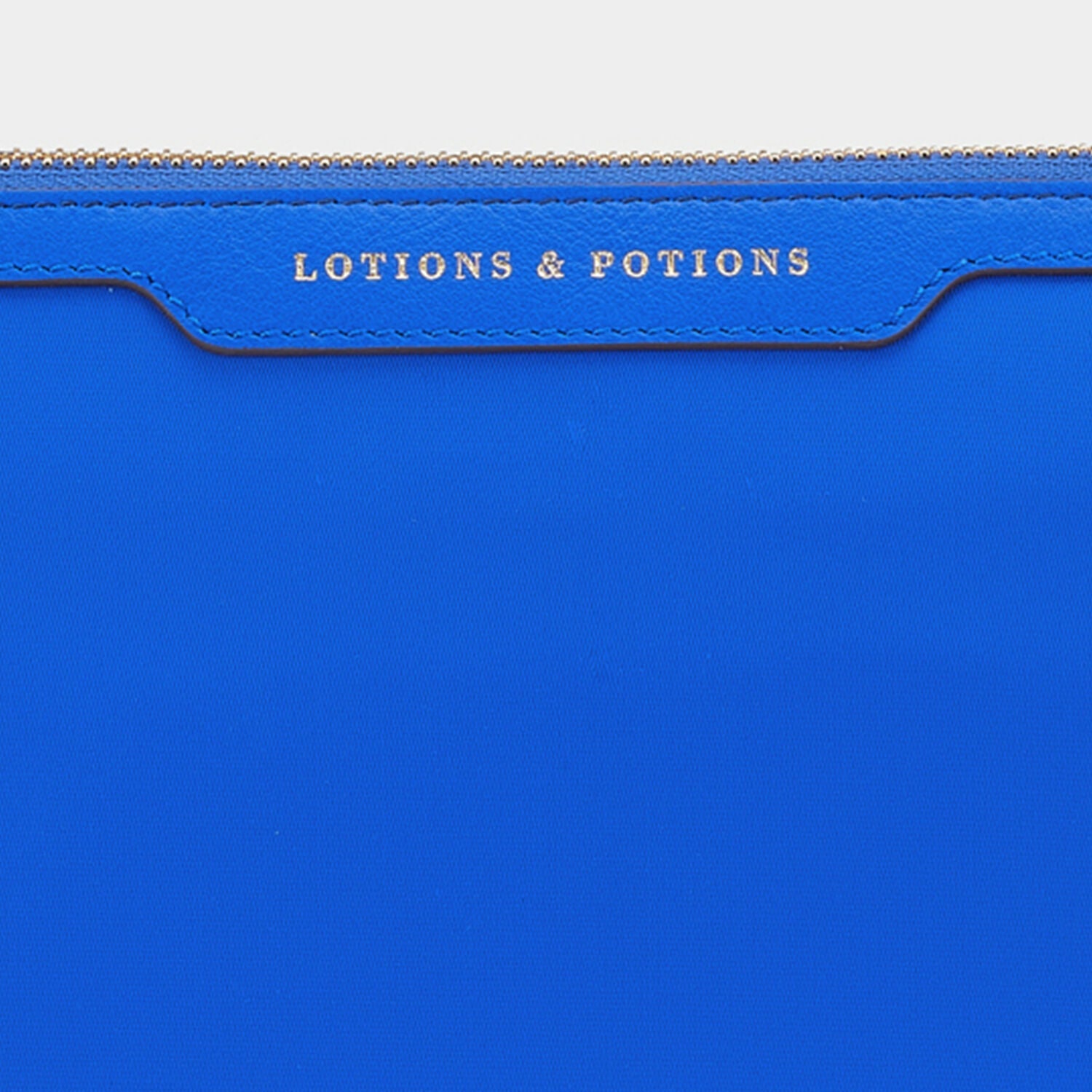 Lotions and Potions Pouch -

                  
                    Econyl® in Electric Blue -
                  

                  Anya Hindmarch EU
