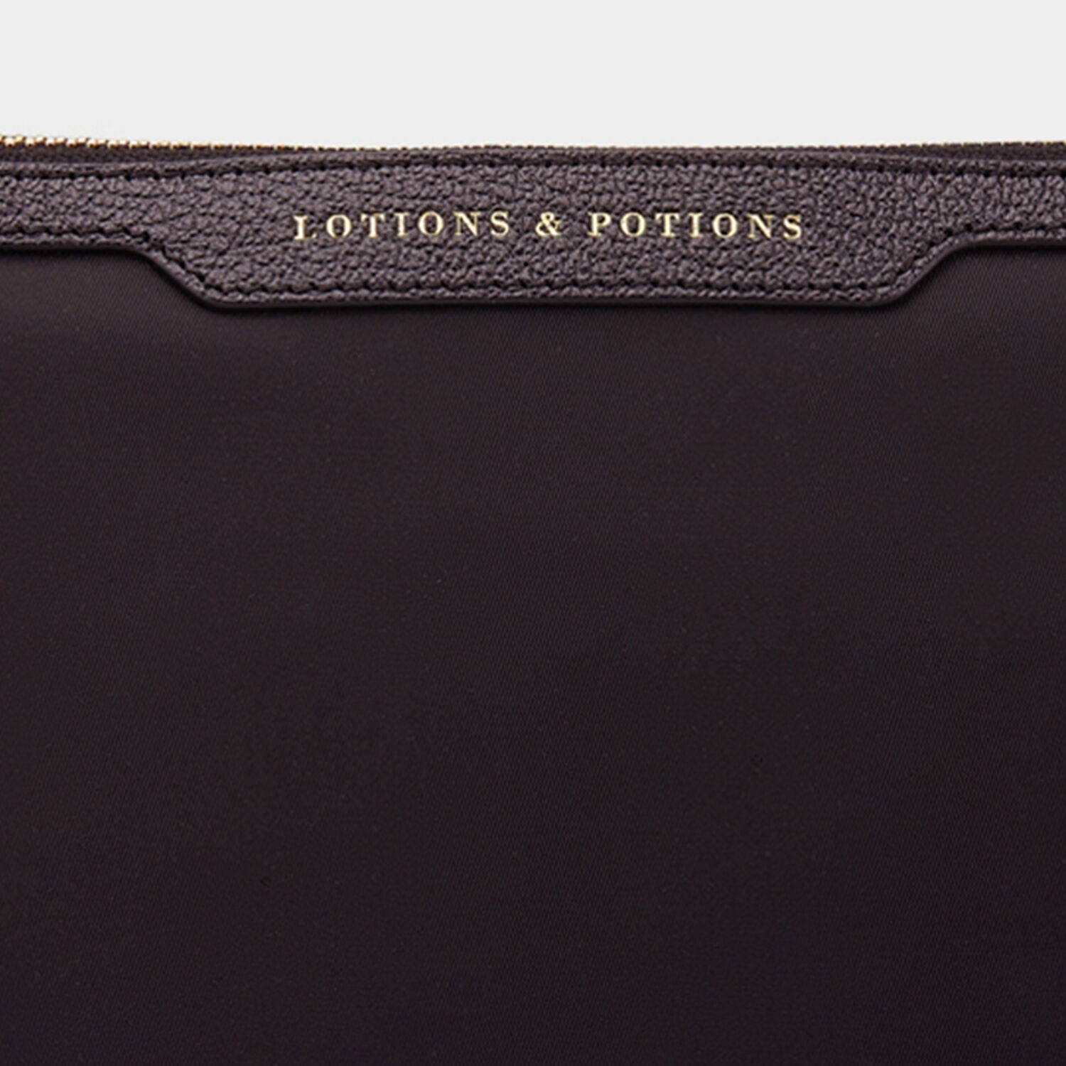 Lotions and Potions Pouch -

                  
                    ECONYL® in Black -
                  

                  Anya Hindmarch EU

